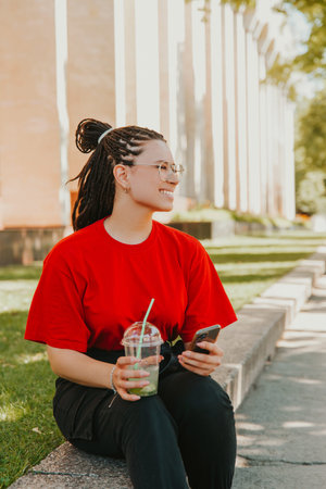 A photo of a girl in park with box braids, networking
