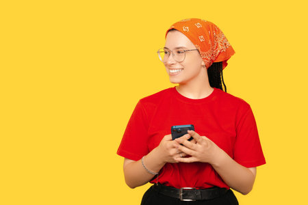 A photo of a woman talking through messages while smiling