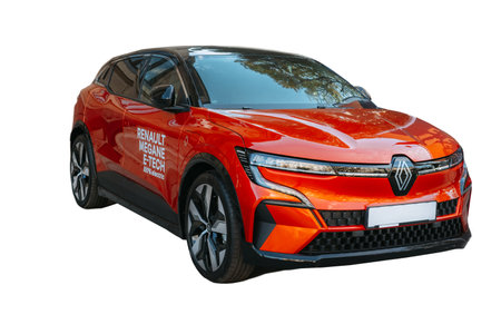 Moldova, Chisinau, 16 september 2022. Brand new beautiful red Renault Megane full electric car isolated on white.のeditorial素材