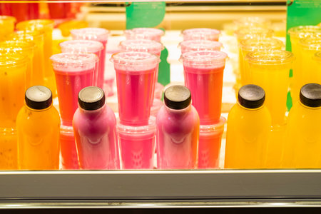 Close up photo of fresh fruit drinks in marketの写真素材