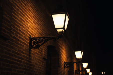 Close up photo of old vintage lamp outdoors during night timeの写真素材