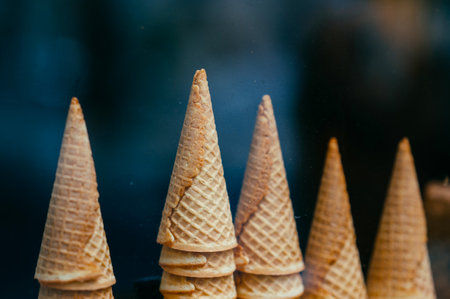Close up shot of some towers made from crispy ice cream waffle cornets.の写真素材