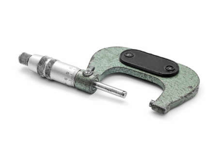 vintage micrometer tool on whiteの写真素材