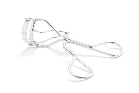 eyelash curler tool on white