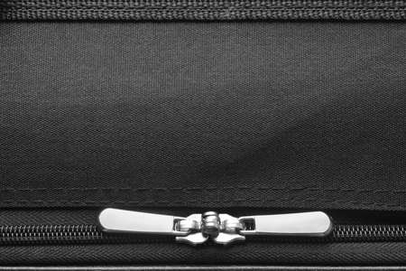 secure lock zipper on blackの写真素材