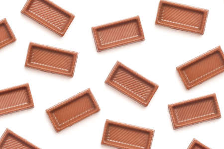 chocolate candy pieces background on whiteの写真素材