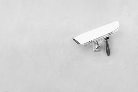 security camera on white wallの写真素材