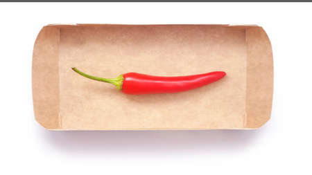 one red chili pepper in boxの写真素材