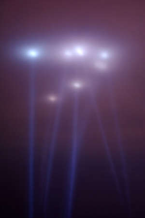 dramatic bright lights v shaped on the night skyの写真素材