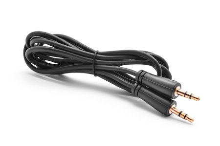 black 3.5 mm. jack audio cable on white background.
