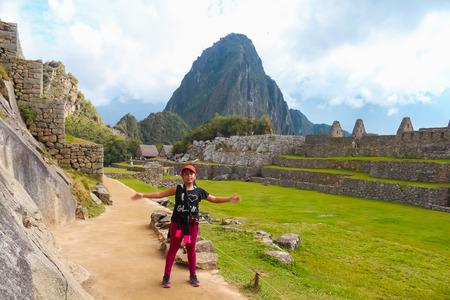 Peru, August 24 of 2015. Little tourist enjoying Machu Picchuのeditorial素材
