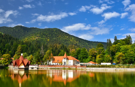 Beautiful landscape of Tusnad spa resort architecture reflected in Saint Ana lake in Romaniaの写真素材