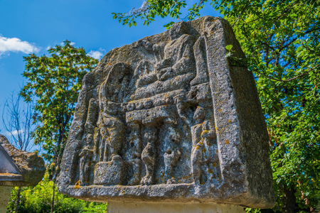 Historical carved scene on a piece of stone coming from the Roman ancient fortress of Histria, in Constanta city,  Romaniaの写真素材