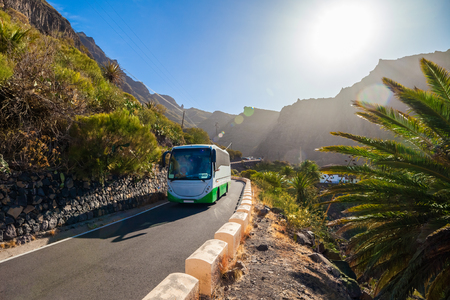 Beautiful landscape with a bus on the road towards Masca village in Tenerife, Canaray island of Spainの写真素材