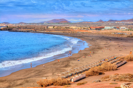 Beautiful view of Tejita beach in summer holiday vith people enjoying the vacation on Canary island, Spainの写真素材