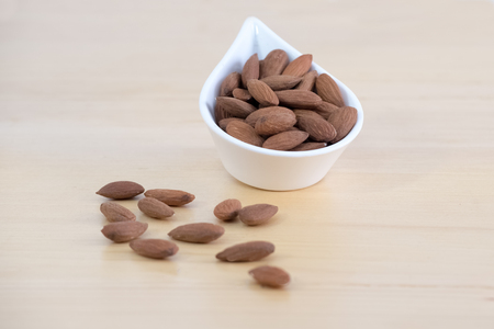 Almonds fruit on wooden backgroundの写真素材
