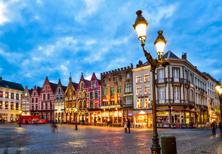 Bruges, Belgium - February 23 , 2016: Tourists on Grote Markt square in Bruges, Belgium. Bruges is touristic center of Flanders city of Brugge, Belgium.