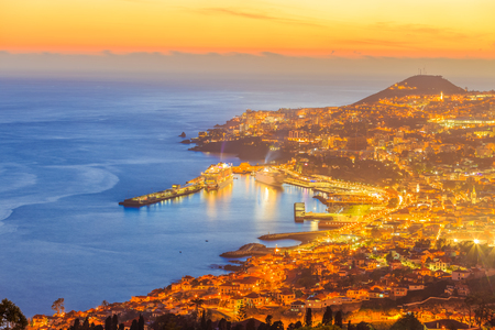 Scene of Funchal capital illuminated at twilight hour, in Madeira, Island - Portugalの写真素材