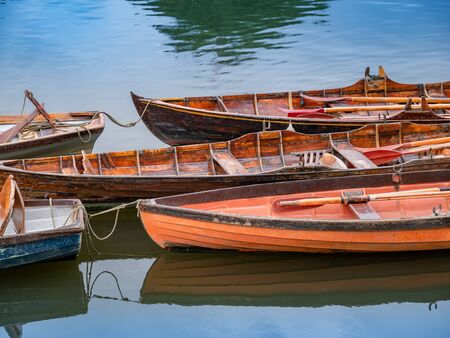 Vintage wooden boats on the Thames rive in London in a sunny dayの写真素材