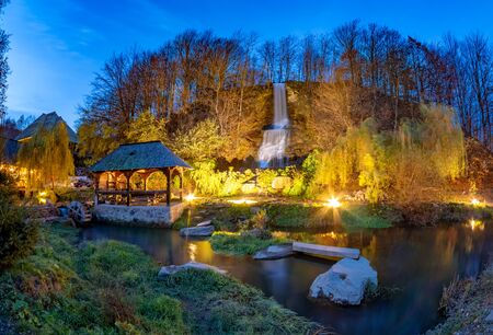 Night scene of Maramures with traditional maze mill among the river and a small waterfall in Sighetu Marmatiei - Romaniaの写真素材