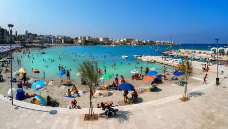 Otranto, Lecce, Italy - August 10, 2018: Seashore and beach in summertime and people enjoying holiday at the seasideのeditorial素材