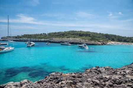 Beautiful sailing area by the sea on the coast of Mallorca island with blue and clear water in the summer season in Spainの写真素材
