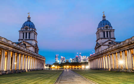 Historic Chapel architecture of St Peter and St Paul old Naval Royal College against the city of London at duskのeditorial素材