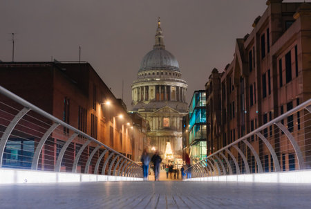 View from the Millennium Bridge of the Saint Paulâs Cathedral in the city of London illuminated at duskの写真素材