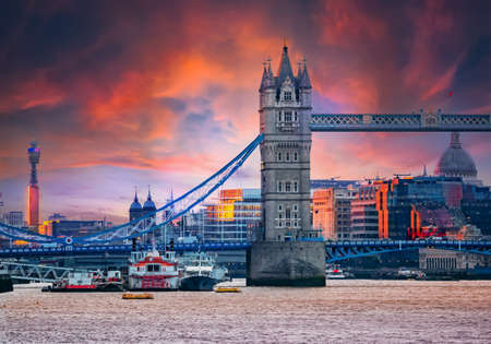 Iconic landmark of London Tower Bridge, historical architecture accros the River Thames in sunset light in Englandの写真素材