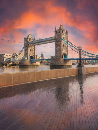 Beautiful scene of the historical Tower Bridge of London illuminated at sunrise in Englandの写真素材