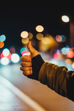 detail of a hand hitchhiking waiting to be picked upの写真素材