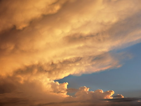 Dramatic sunset sky with stormy clouds. Nature background.の写真素材