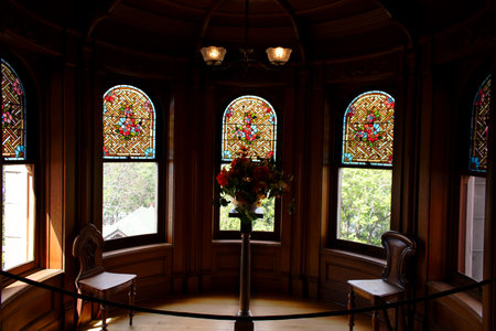 Interior of a church with a glass window and a vase of flowersの写真素材