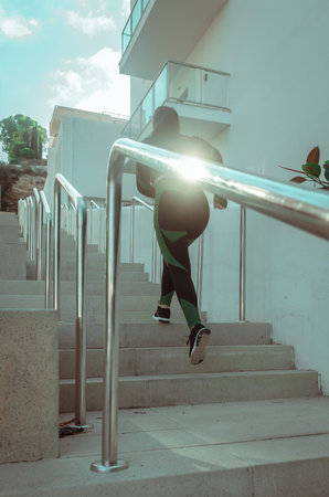woman running up stairs on the street