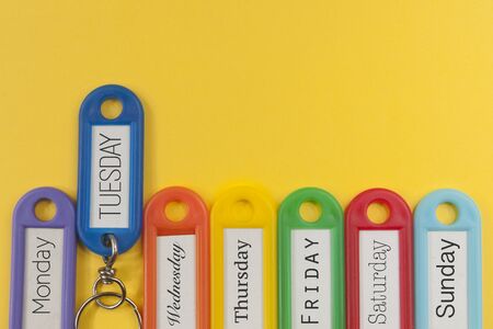 Key holders with names of the day of the week on themの写真素材