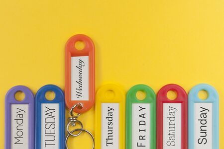Key holders with names of the day of the week on themの写真素材