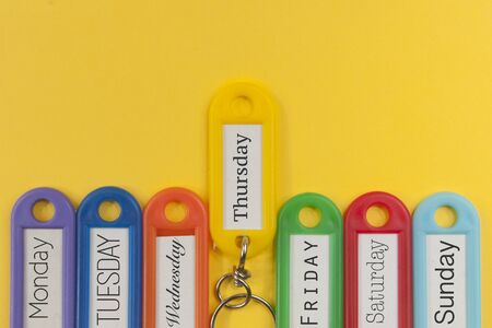 Key holders with names of the day of the week on themの写真素材
