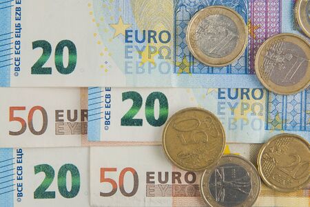 20 and 50 euro banknotes and coins backgroundの写真素材