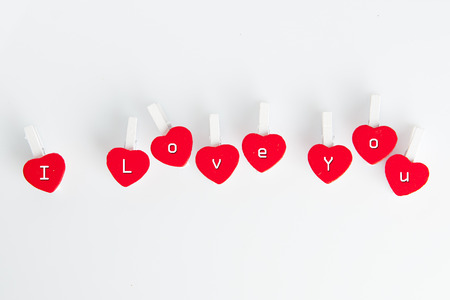 Valentine's day: I love you text on heart shaped clothespinsの写真素材
