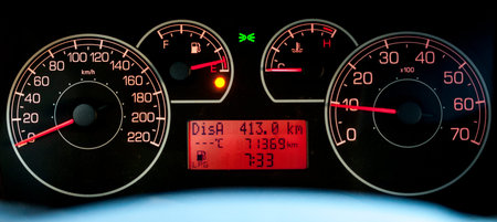 Italian car dashboard with odometer and rev counter