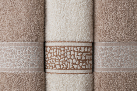 Bath towels lined up on the table, macro shot backgroundの写真素材