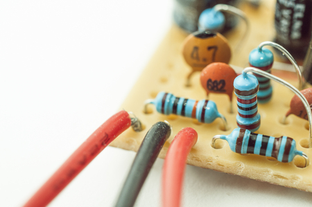 Detail of electronic circuit made on veroboard with copy space and white backgroundの写真素材