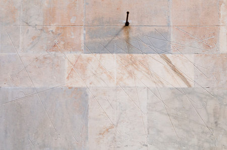 Chatedral of St. Andrea. Carrara. Tuscany. Italy - Sundial carved on the facade