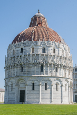 Pisa, the baptistery in the Piazza Dei Miracoli fieldの写真素材