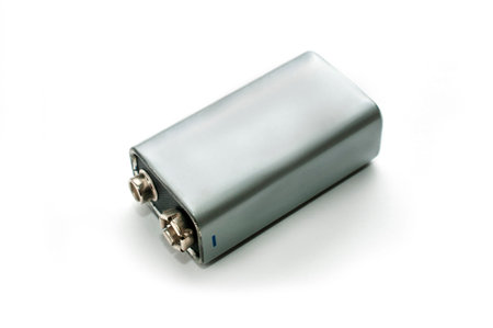 A blank silver 9v battery on white background