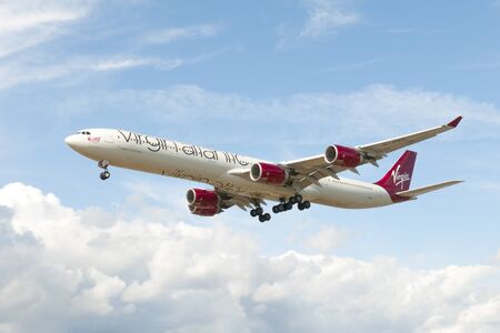 Heathrow, England - June 29, 2019 - Virgin Atlantic Airbus a340 lands at Heathrow airport in Londonのeditorial素材