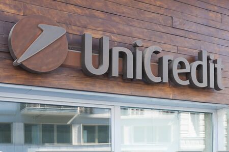 Carrara, Italy - August 11, 2019 - The logo of Unicredit on the entrance of a agency in Tuscanyのeditorial素材