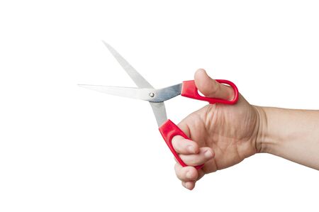 Man hold a red pair of scissors on white backgroundの写真素材
