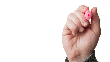 Man hold a pink highlighter on white backgroundの写真素材