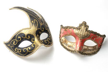Two theater or mardi gras venetian masks on white backgroundの写真素材